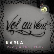 Flowing script tattoo reading “Vol au Vent”